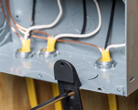 electrical panel box break out plug|electrical panel knockout problems.